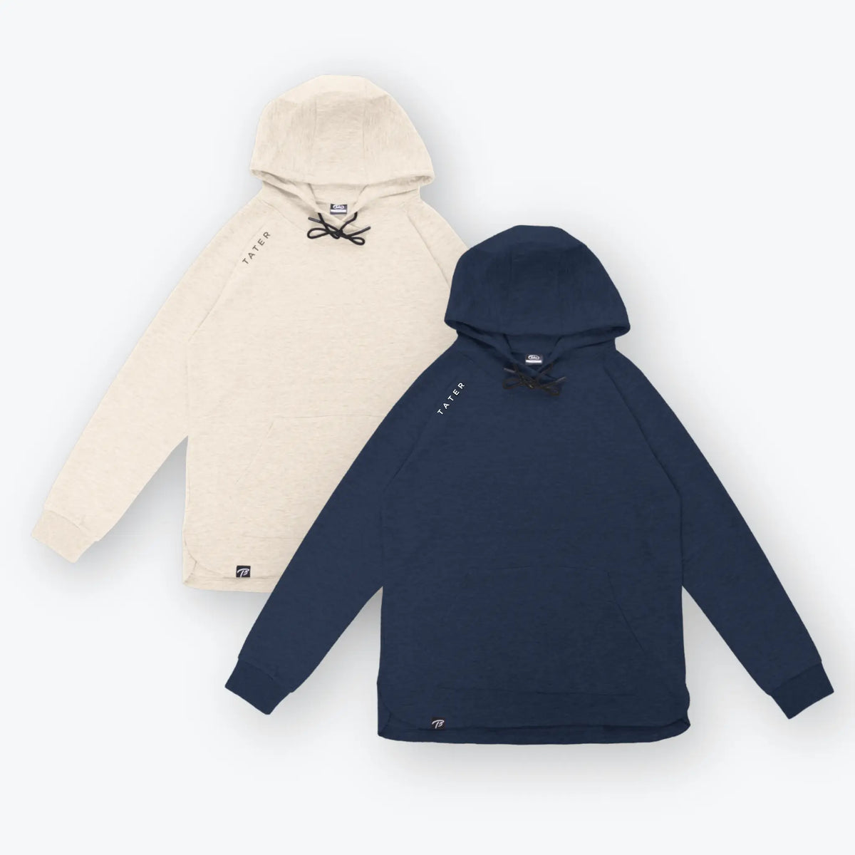 The image features two hoodies from Tater Baseball&#39;s Fundamentals collection. One hoodie is cream-colored, and the other is navy, both sporting the &quot;TATER&quot; logo on the left chest area. They present a minimalistic and clean design, suitable for a casual, athletic look.