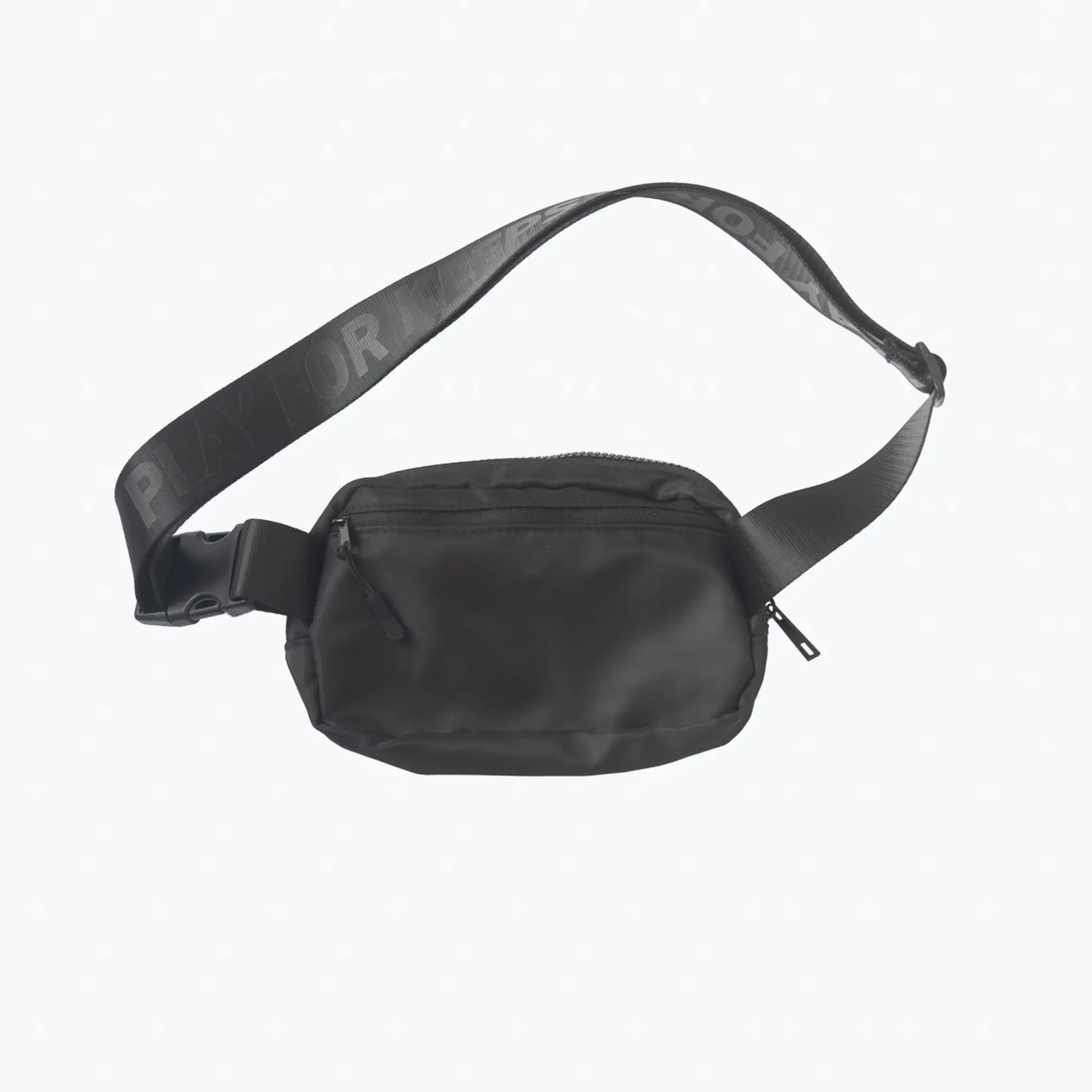 This image displays a black crossbody day bag from Tater Baseball, featuring a sleek design with the brand's logo on the strap, conveying a stylish and practical accessory for everyday use.